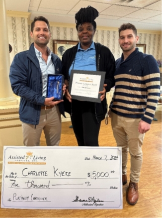 Assisted Living Services, Inc. (ALS) recently honored Ghanaian native Charlotte Kyere as the Ultimate Platinum Caregiver of the Year 2023 at Hoffman Summerwood in West Hartford, Conn. Pictured from left: Mario D’Aquila, chief operating officer at ALS, Charlotte Kyere and Nicholas D’Aquila, chief information officer at ALS with the $5,000 award.