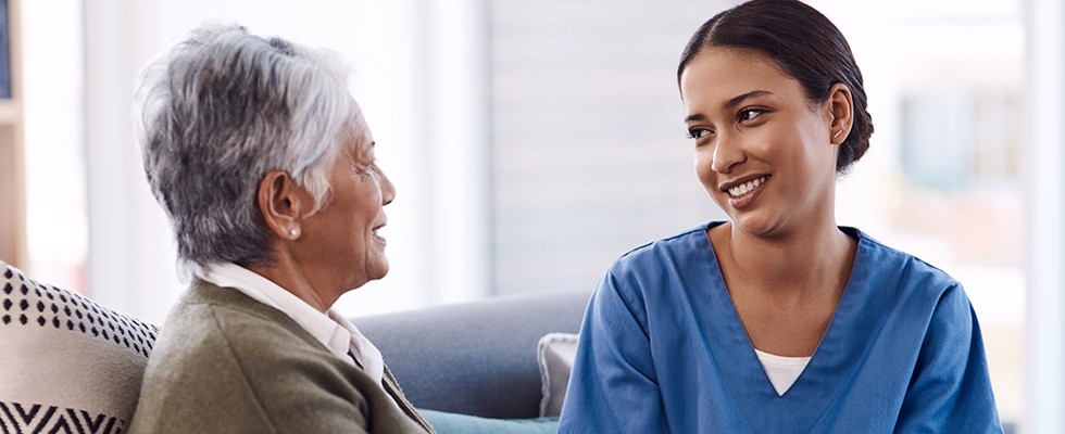 Nurse or caregiver with patient at home