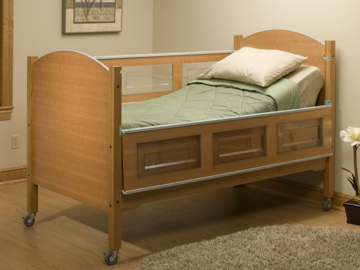 A SleepSafe bed for special needs children, with the rail down.