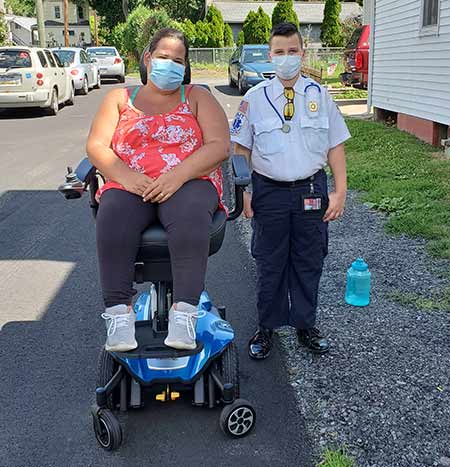 Boy with neighbor in power chair