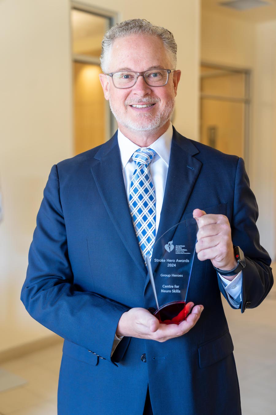 David Harrington, president and CEO of Centre for Neuro Skills, with the 2024 American Heart Association Group Stroke Hero award.