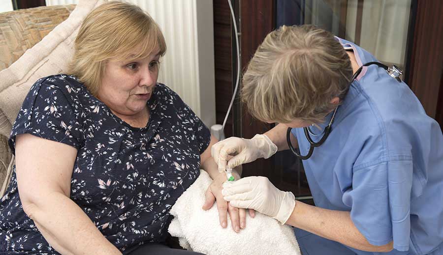 woman receiving home infusion