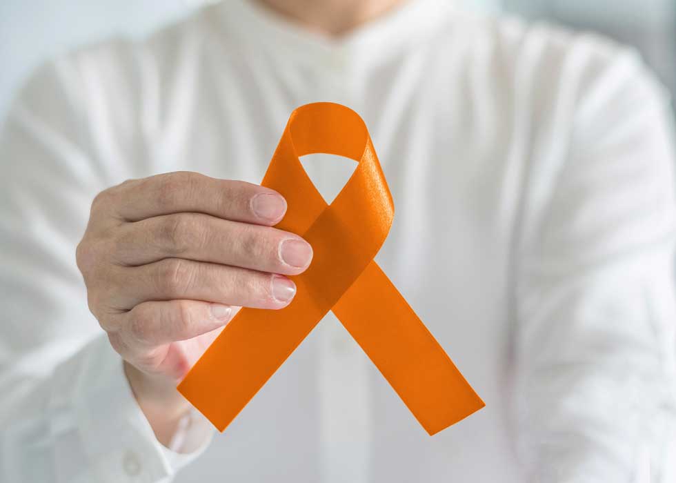 hand holding orange ribbon for COPD awareness