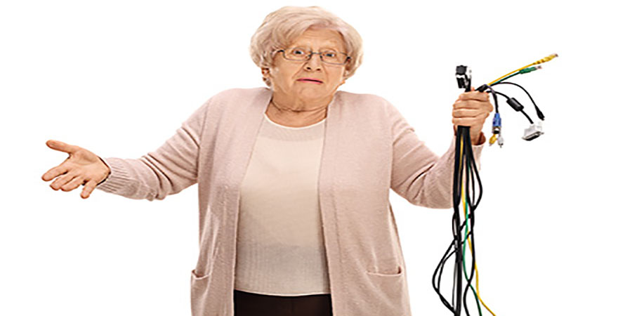 confused elderly woman with connection cables