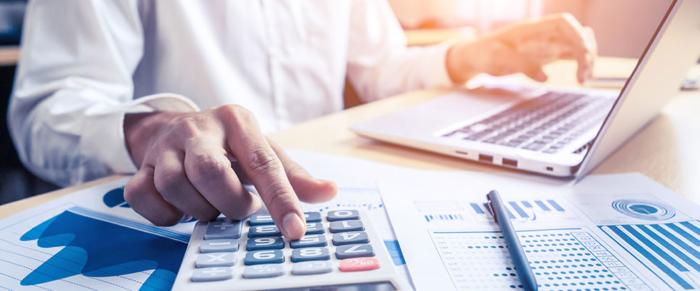 person doing financial calculations