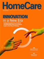 The cover of the July issue of HomeCare Magazine with an orange cover and two hands reaching for each other