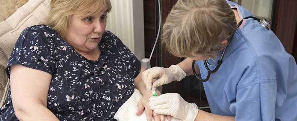 woman receiving home infusion