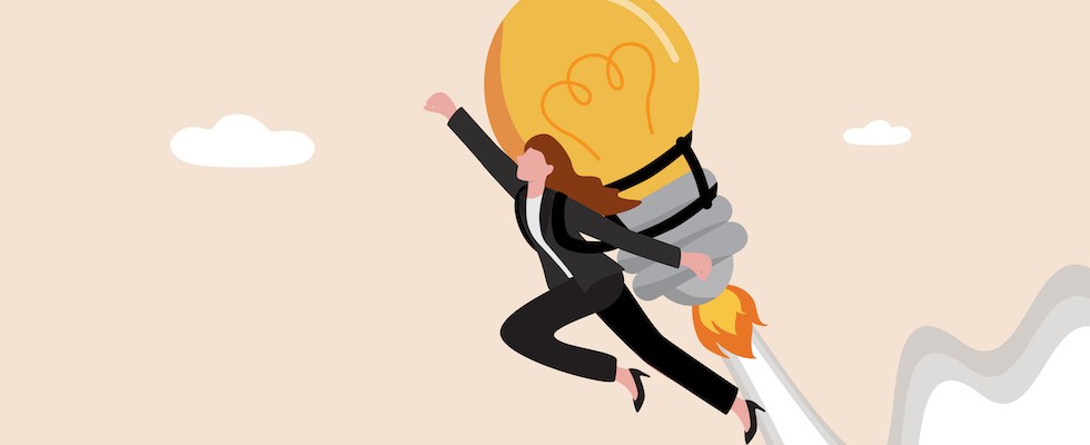 Woman in suit flying with lightbulb behind her