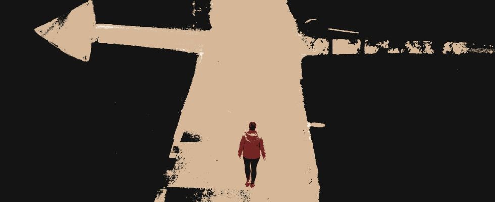 A graphic of a person walking down a split road