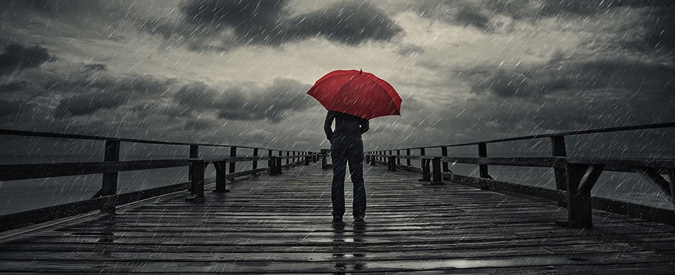 illustration of person standing in the rain