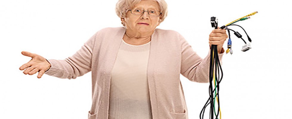 confused elderly woman with connection cables