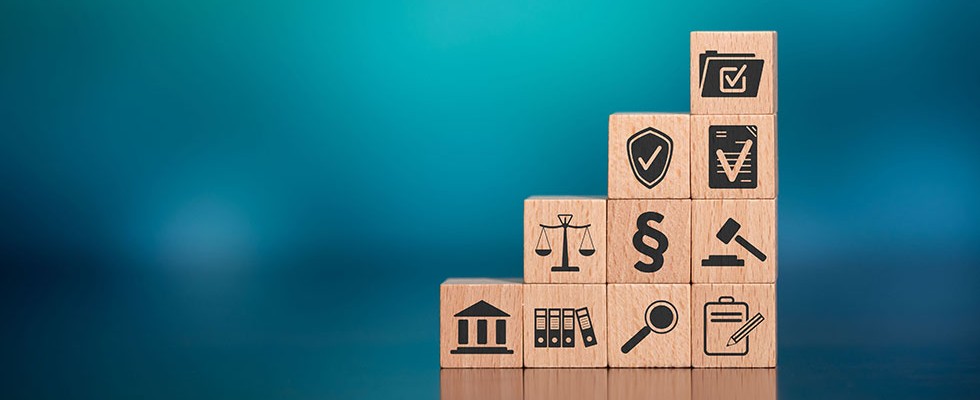 wooden blocks in a staircase with different legal symbols on them