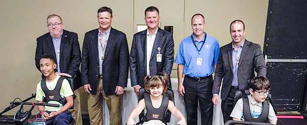 Back L-R: VGM representatives Greg Packer of U.S. Rehab, Clint Geffert, Scott Owen, Mike Mallaro, and Tyler Mahncke of U.S. Rehab. Front L-R: Jamari Kruse, 11; Zoey Down, 5; and Jayben Westlund, 8.