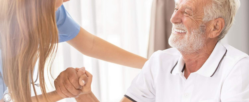 nurse helps man