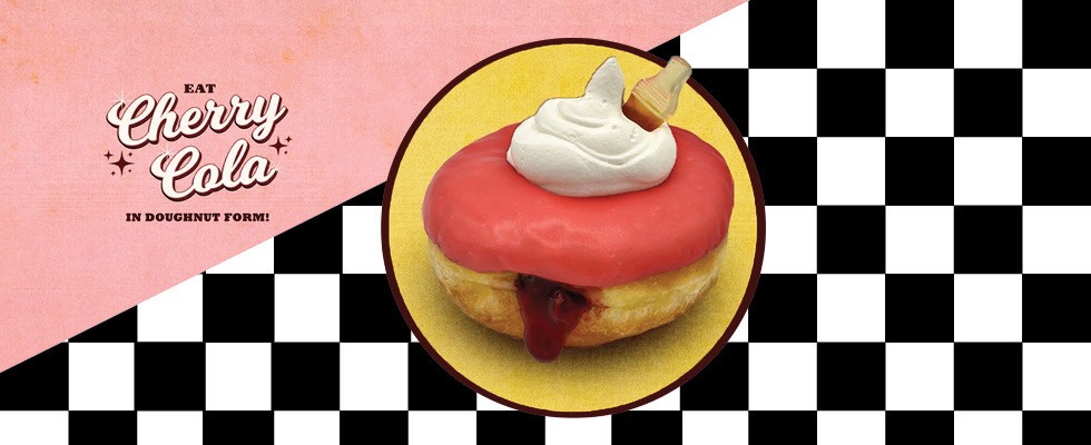 A cherry cola flavored donut on top of a blackened white checkered background
