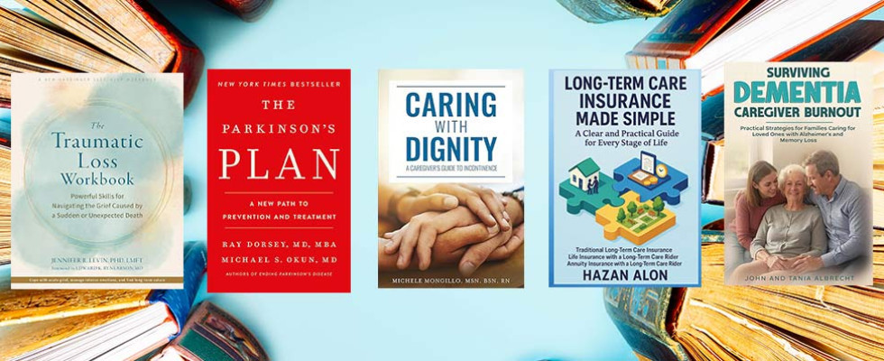 Five books lined up in front of a blue backdrop