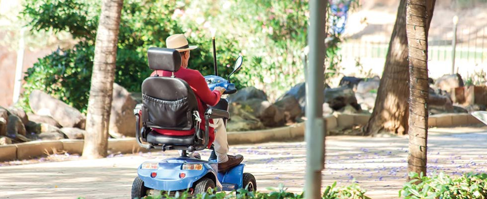 A person riding a mobility scooter.