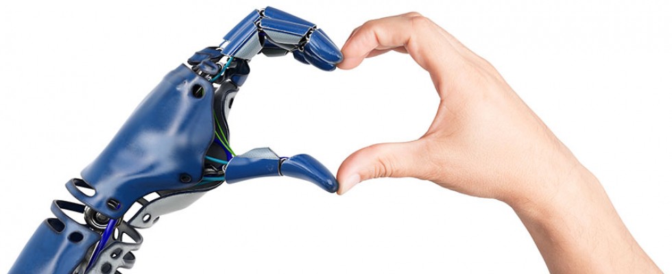 robot and human hand making a heart