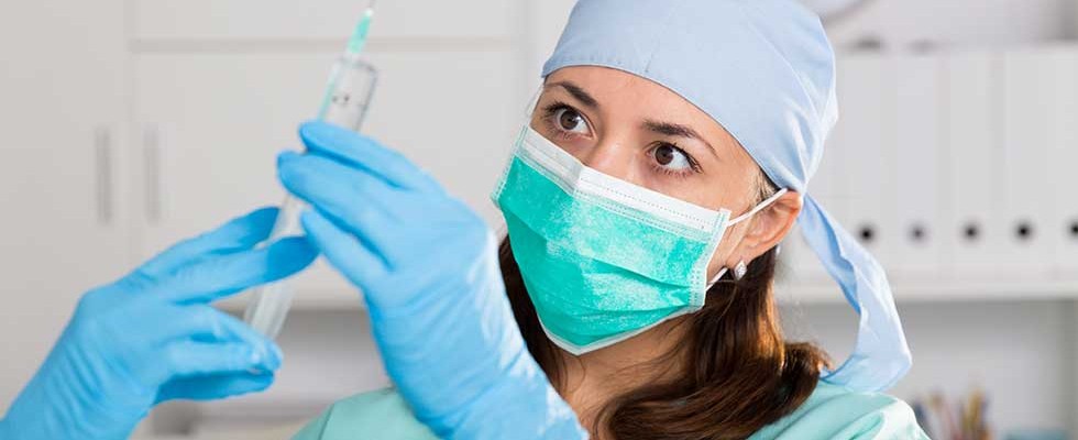 nurse preparing vaccine