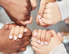 An image of two people holding hands