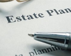An image of paper with "Estate Planning" printed as the header and a pen 
