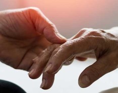 doctor's hand grasping patient hand