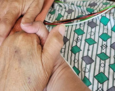 Oralia Terrazas holding her mother's hand.