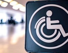 Sign with an image of a person using a wheelchair
