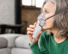 An image of an older woman with an oxygen mask on.