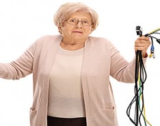 confused elderly woman with connection cables