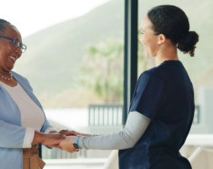 a nurse is thanked by a client in a home setting 