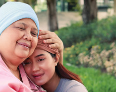 Two women embracing.