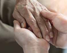 Two people holding hands. 