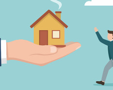 A cartoon graphic of a large hand holding a small house while a small figure of a man runs towards it