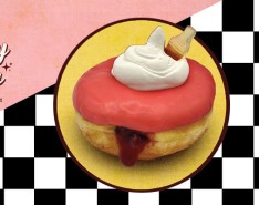 A cherry cola flavored donut on top of a blackened white checkered background