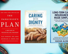 Five books lined up in front of a blue backdrop