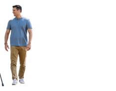 Two men stand next to each other, one of them with leg braces and crutches.