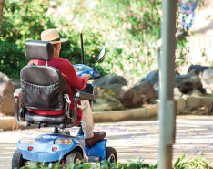 A person riding a mobility scooter.