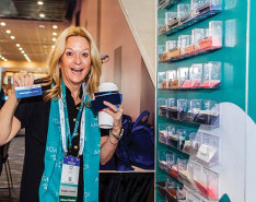 Two women holding up ribbons from the National Alliance for Care at Home Conference & Expo