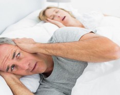 snoring woman keeping partner awake