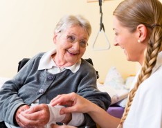 caregiver takes care of older woman