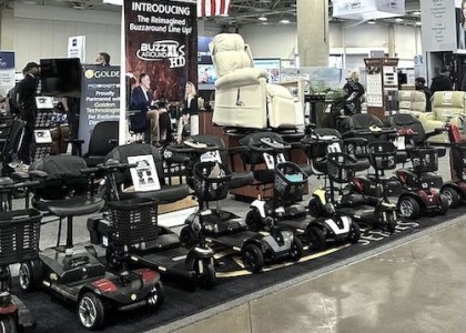 An image of mobility products lined up under a Golden sign at Medtrade 2024