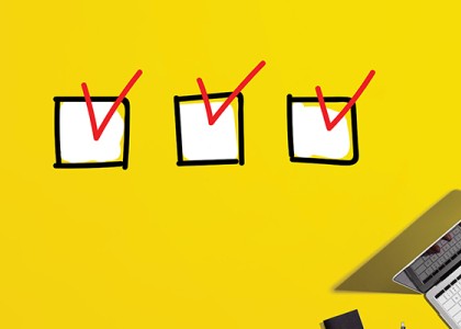 A yellow background with three checkmarks