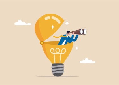 An illustration of a man in suit in a lightbulb with binoculars 