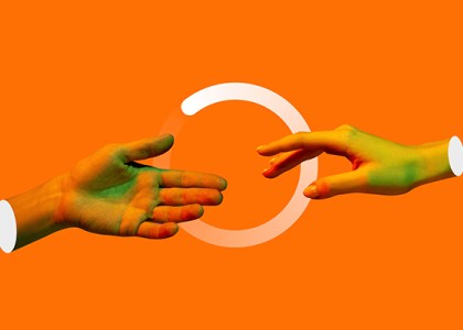 An orange background with two hands reaching out over a loading screen circle