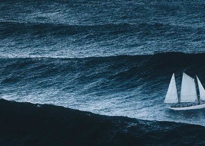 A sailboat out on choppy waves
