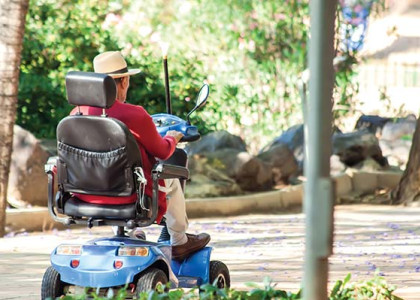 A person riding a mobility scooter.