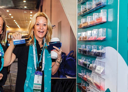Two women holding up ribbons from the National Alliance for Care at Home Conference & Expo