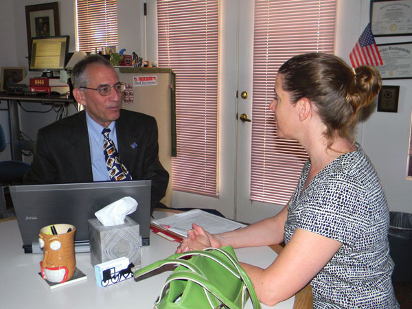 Barry Krakow, M.D., medical director of Maimonides Sleep Arts and Sciences, Ltd., consults with one of his patients. Photo by Sable Yliza Krakow.