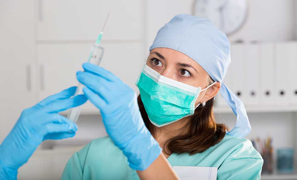 nurse preparing vaccine